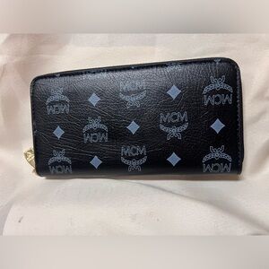 Black full zip Mcm wallet PRE loved but no signs of wear